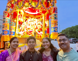 Meghana with her family on the tenth day of Brahmotsavam, translated from Sanskrit as “grand festival”, during Rathotsavam. It is a South Indian religious event that commemorates Lord Vishnu (the preserver) and his kalyanam (marriage) to his two wives as they are all carried on a wooden chariot around the temple.